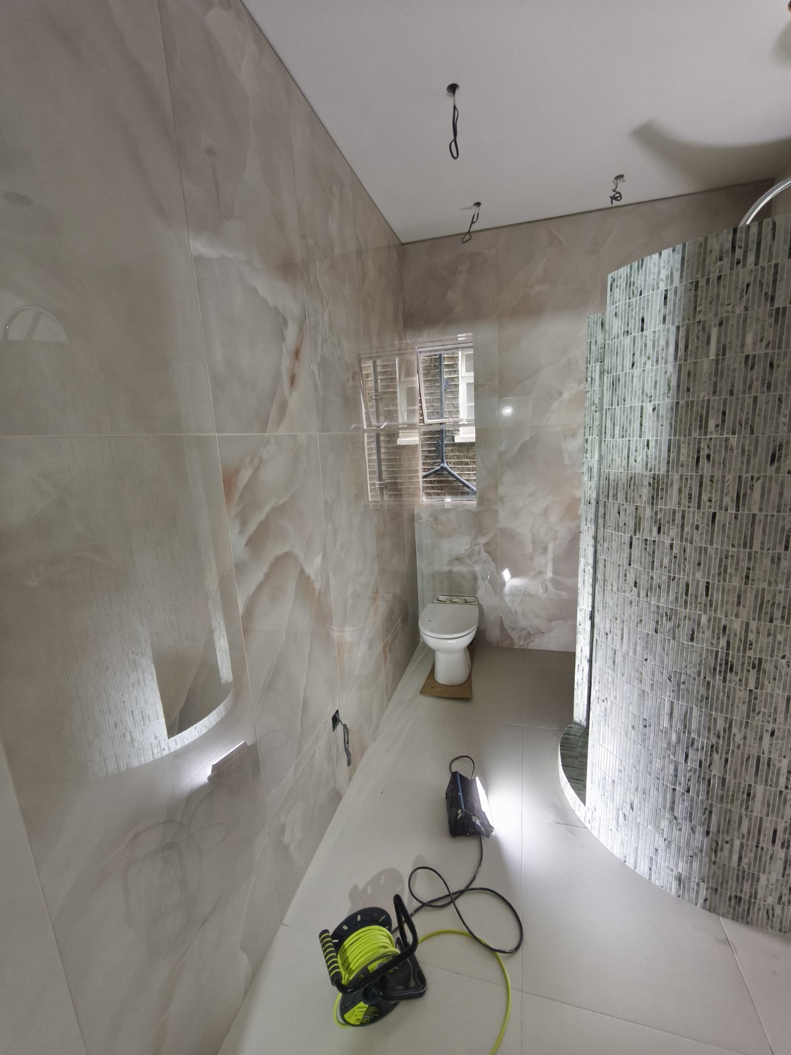 Curved mosaic shower enclosure