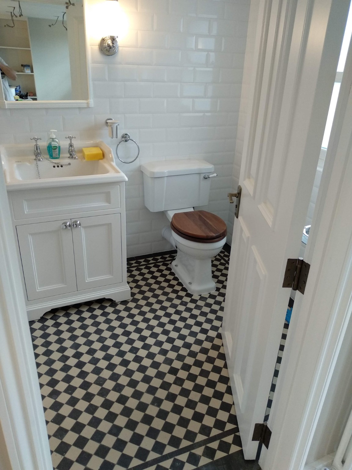 Victorian bathroom with checkerboard tiled floor